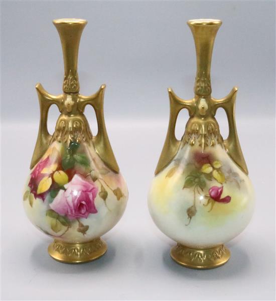 Two similar Royal Worcester bottle vases, by Spilsbury (repaired) and M. Hunt, shape 305